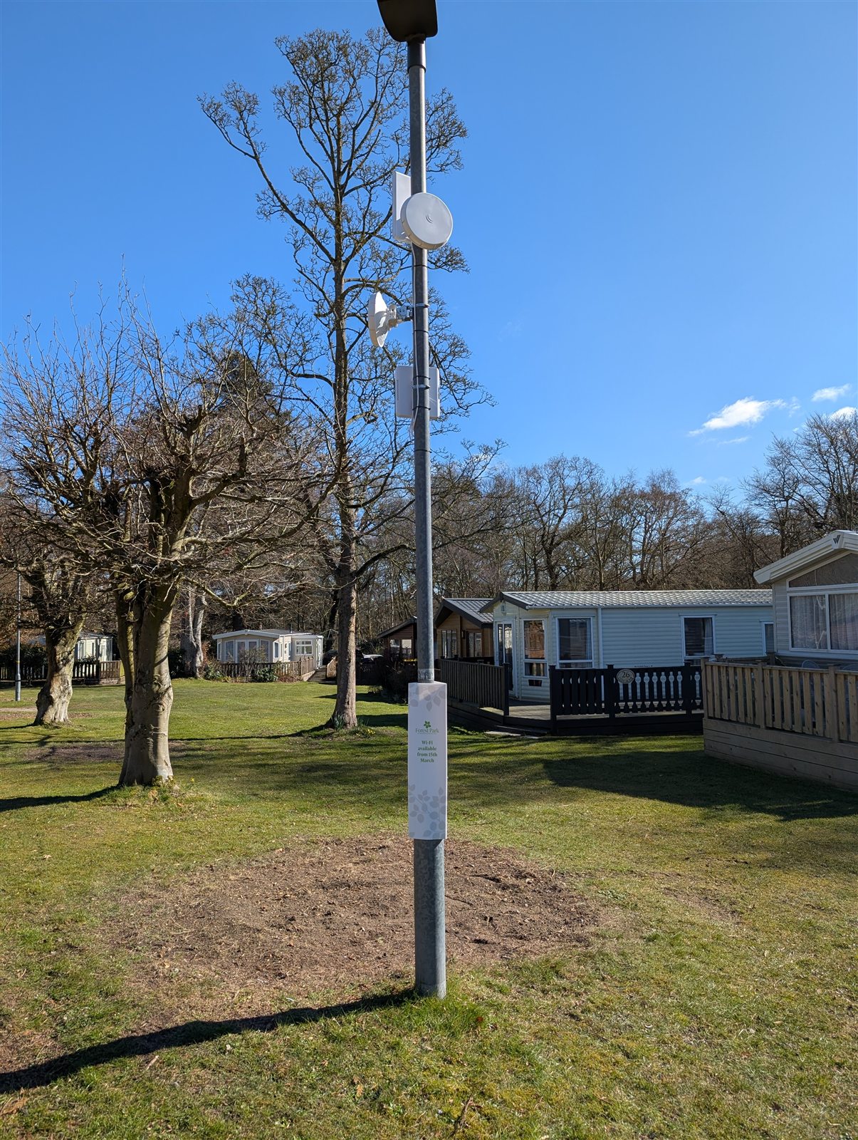 Pole-mounted directional radios among holiday homes at Forest Park
